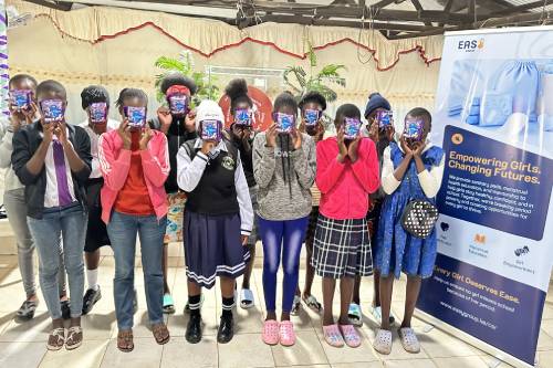 School girls participate in an Easy Group menstrual health outreach session in Kibera after receiving sanitary pads.