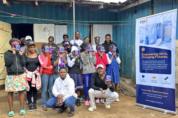 Easy Group volunteers and school girls during a sanitary pad distribution outreach programme in Kibera, Nairobi.