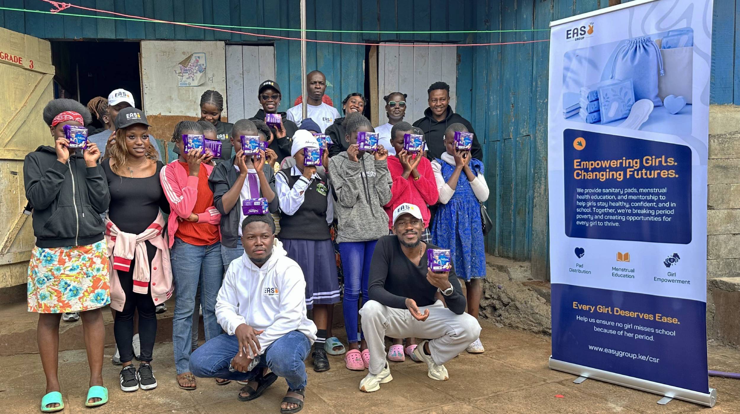 Easy Group team with girls during a menstrual health outreach at MOC School in Kibra.